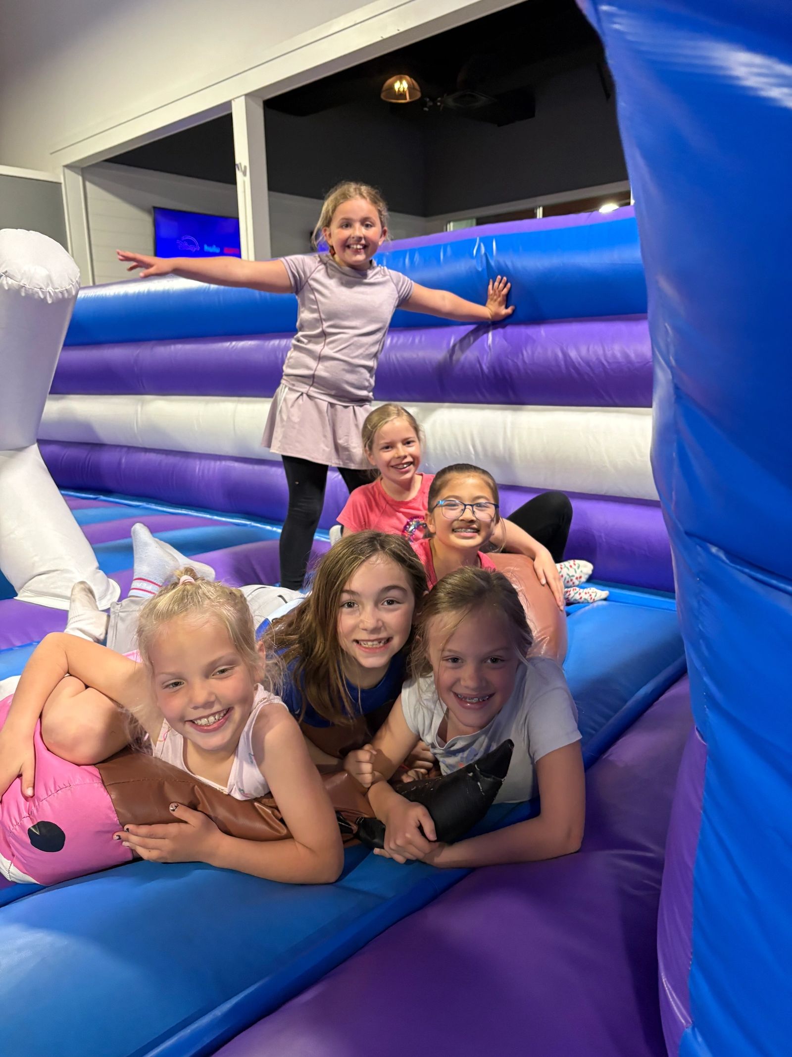 Kids on an inflatable bounce structure